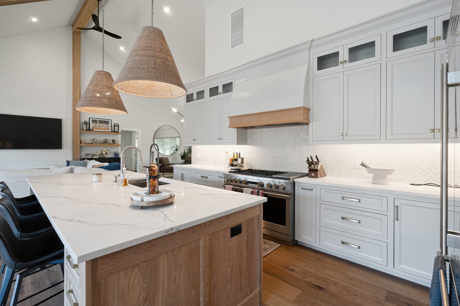 Chef's kitchen with white-oak island, quartz counters, herringbone tile backsplash and a stainless pro range - 43 Moody Lane, a custom home in Danbury, CT
